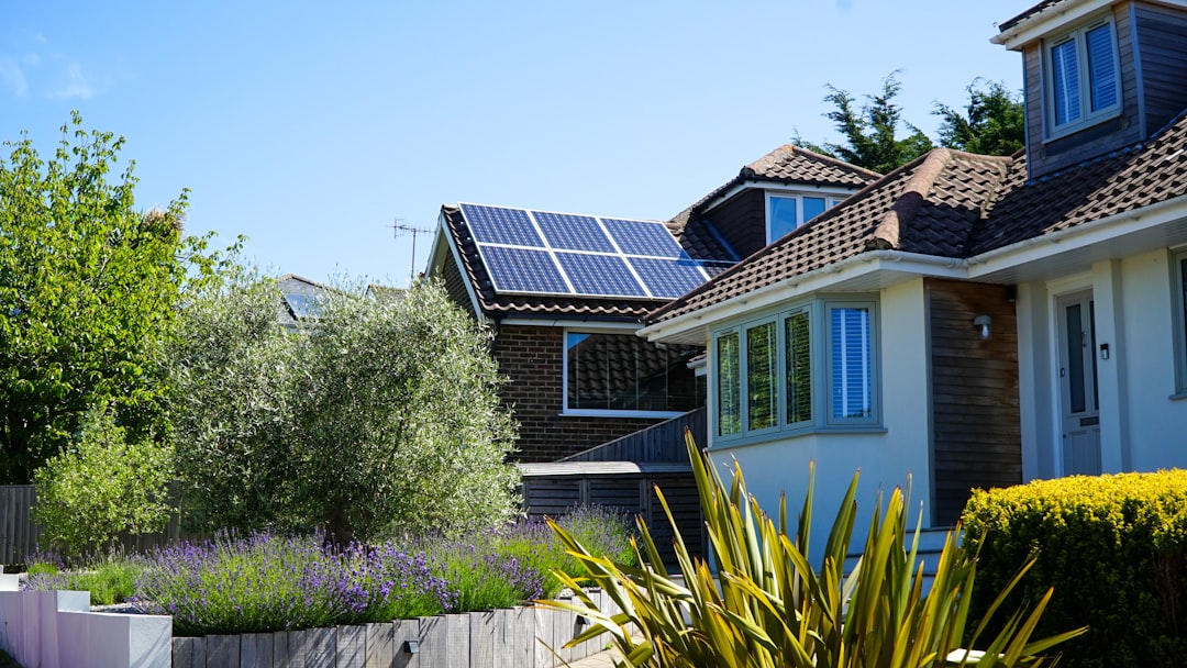 Home Solar panels in the midday sun on a house roof