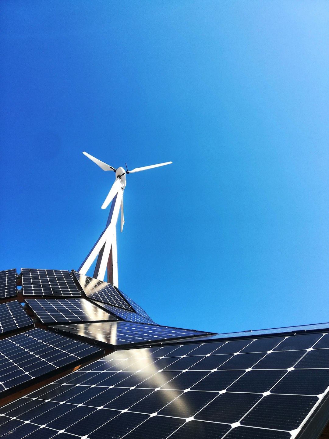 Home white-wind-turbine-on-top-of-a-building-ikjaj-oq-ie